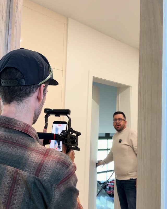 Videographer from Be Wise shooting a corporate video with a stabilizer, Laurentians